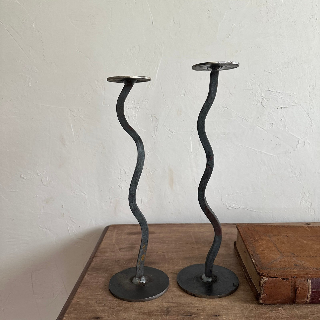 one of a kind pair of handcrafted iron candle holders