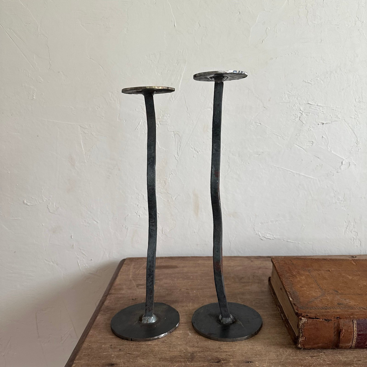 one of a kind pair of handcrafted iron candle holders